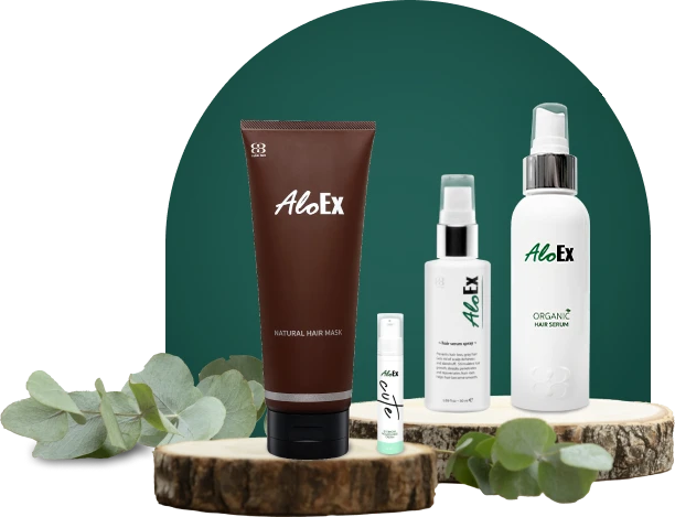 AloEx 3 treatment products on wooden disc with eucalyptus