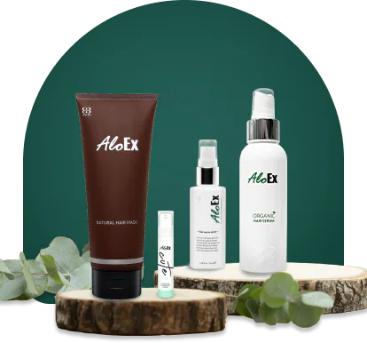 AloEx 3 treatment products on wooden disc with eucalyptus